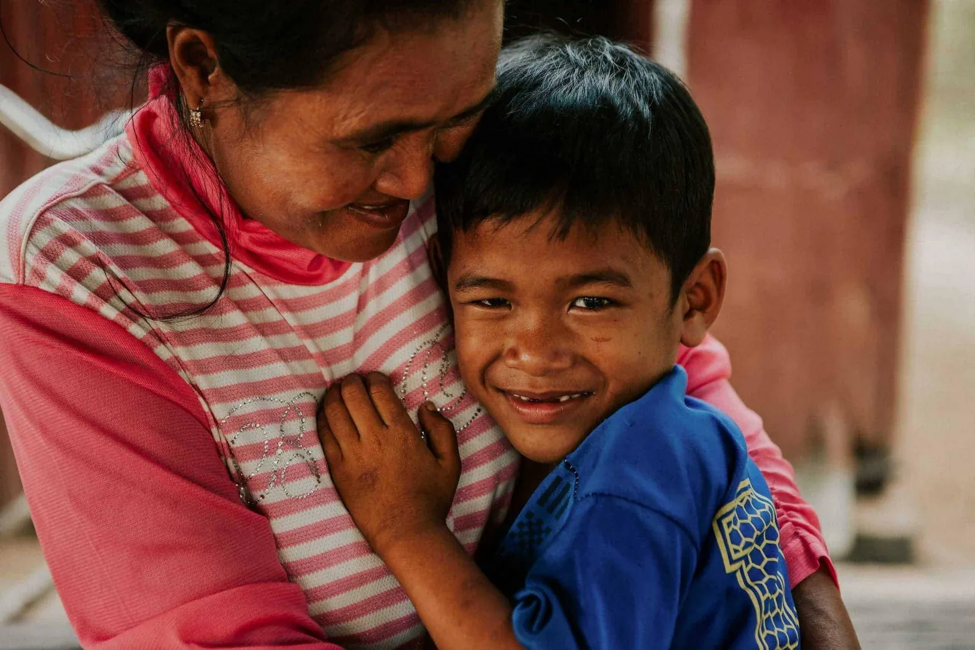 Hugs for mum a young boy is all smiles as he hugs his Children in Families foster mum